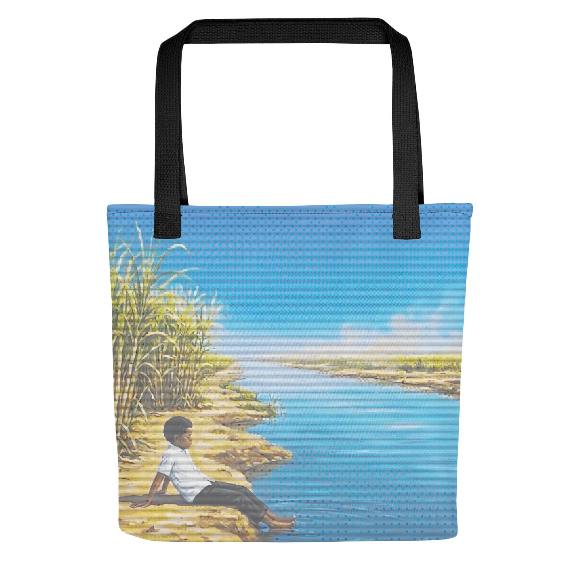 Black-handled tote printed edge to edge with a boy sitting on the bank of the White Nile beside sugarcane